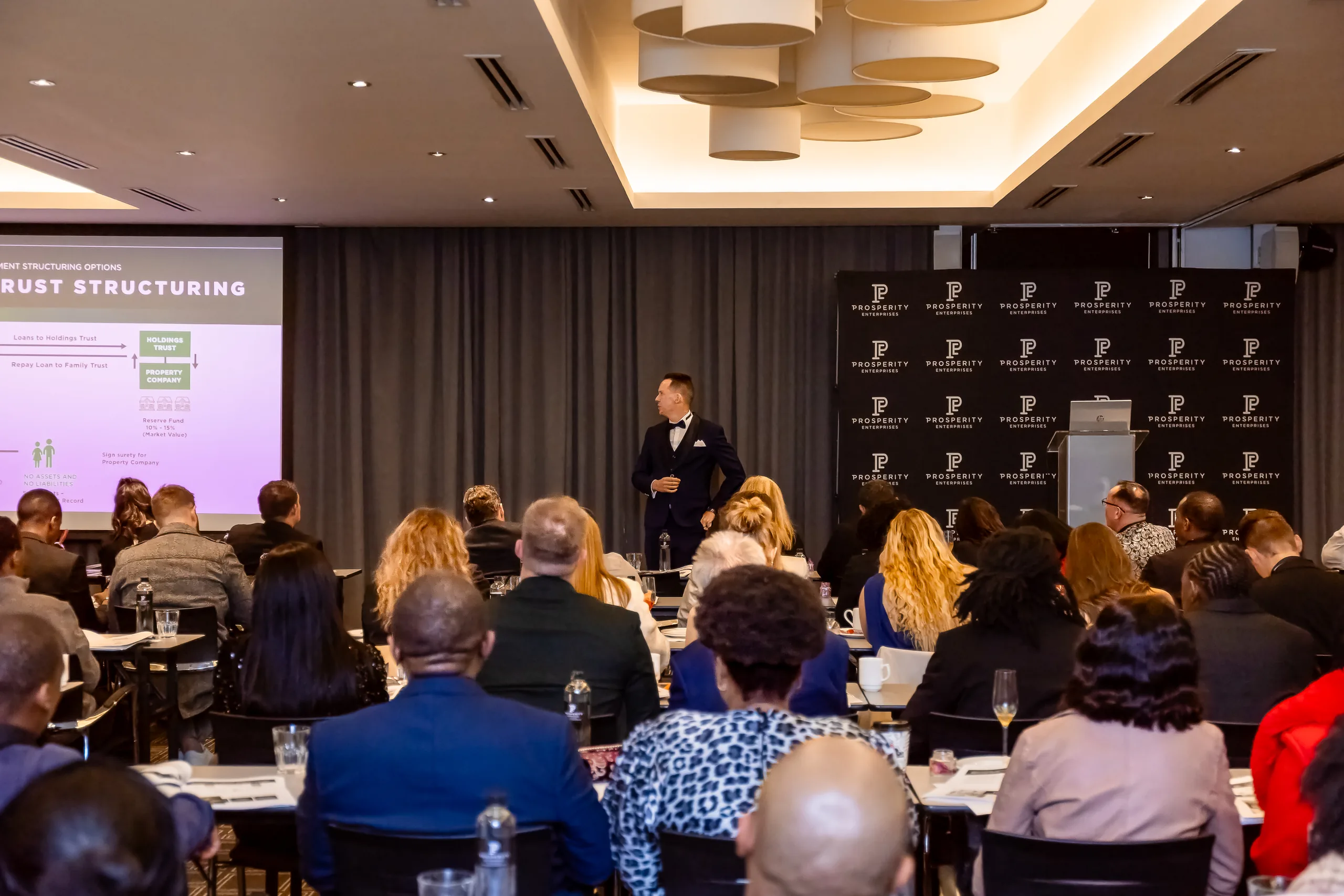 Jaco Grobbelaar speaking at a Prosperity Enterprises property investors evening